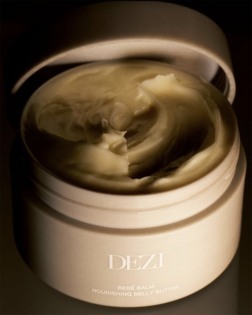 An open jar with the lid off and the whipped butter showing.