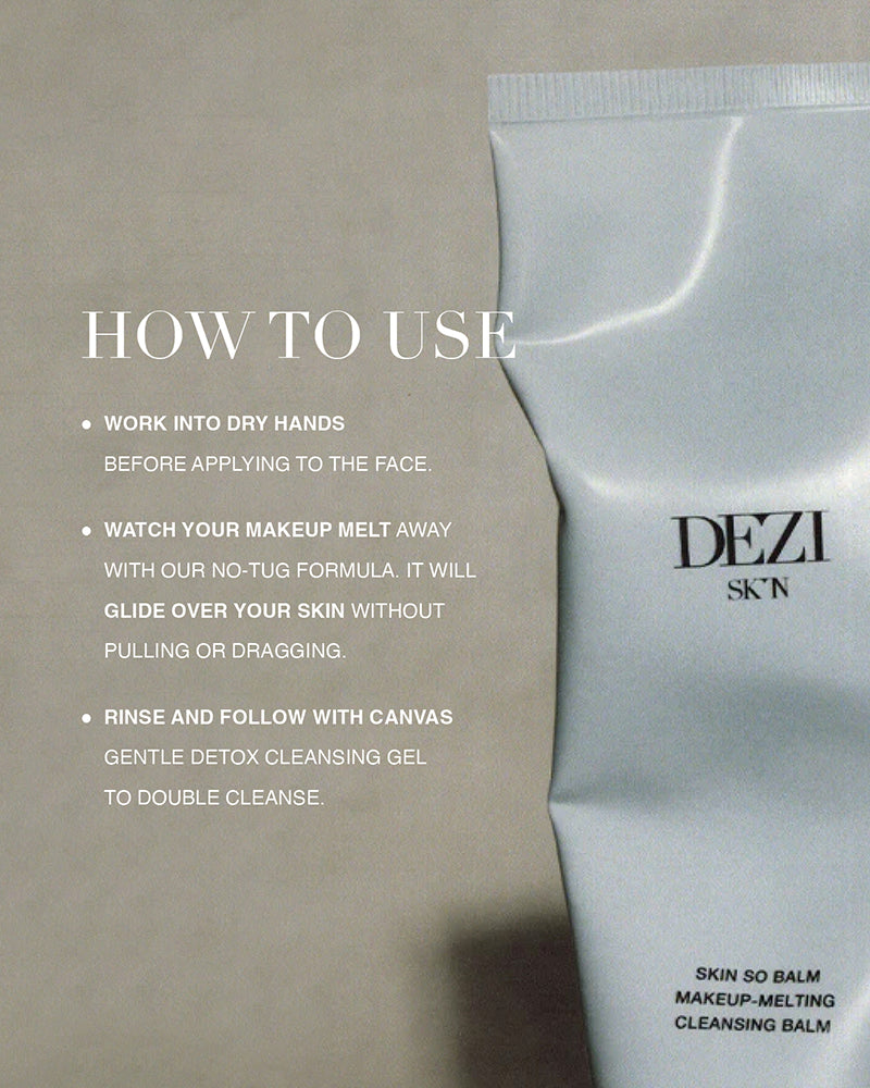 A cleansing balm tube standing with text instructing how to use the product. This is an oil based cleanser for the face.