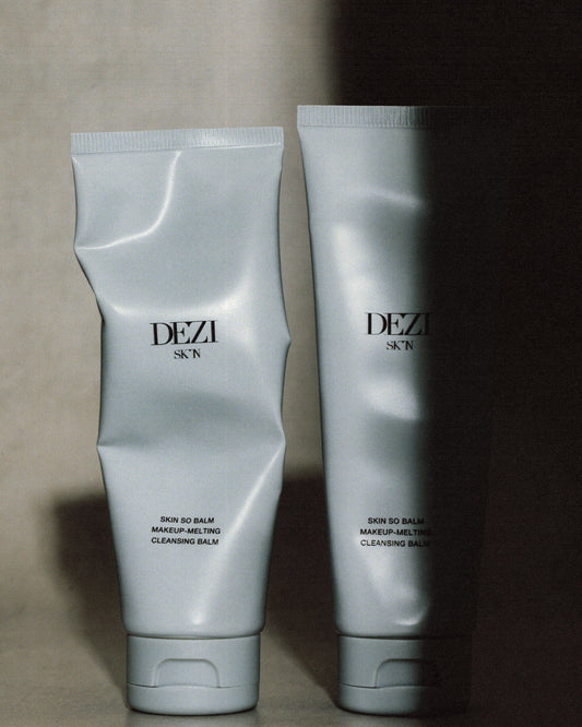 two cleansing balm tubes standing next to each other. This is an oil based cleanser for the face.