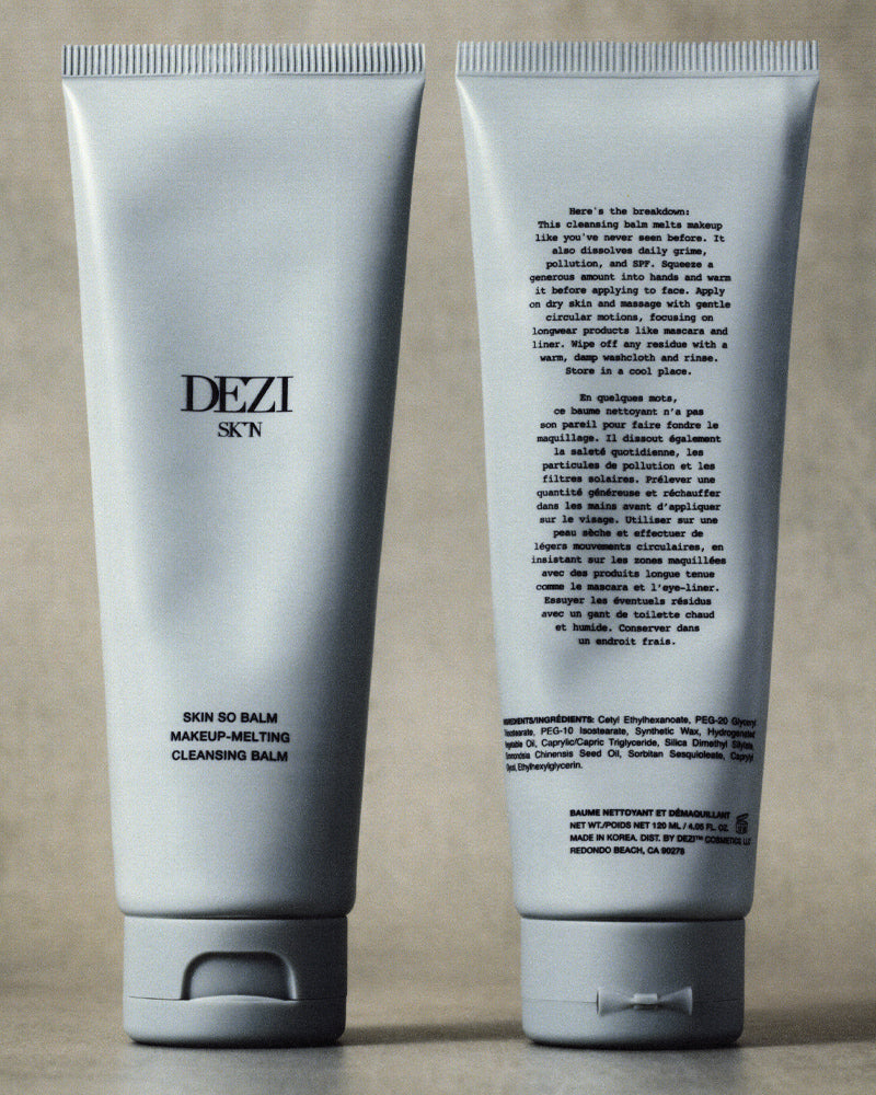 two cleansing balm tubes standing next to each other. This is an oil based cleanser for the face.