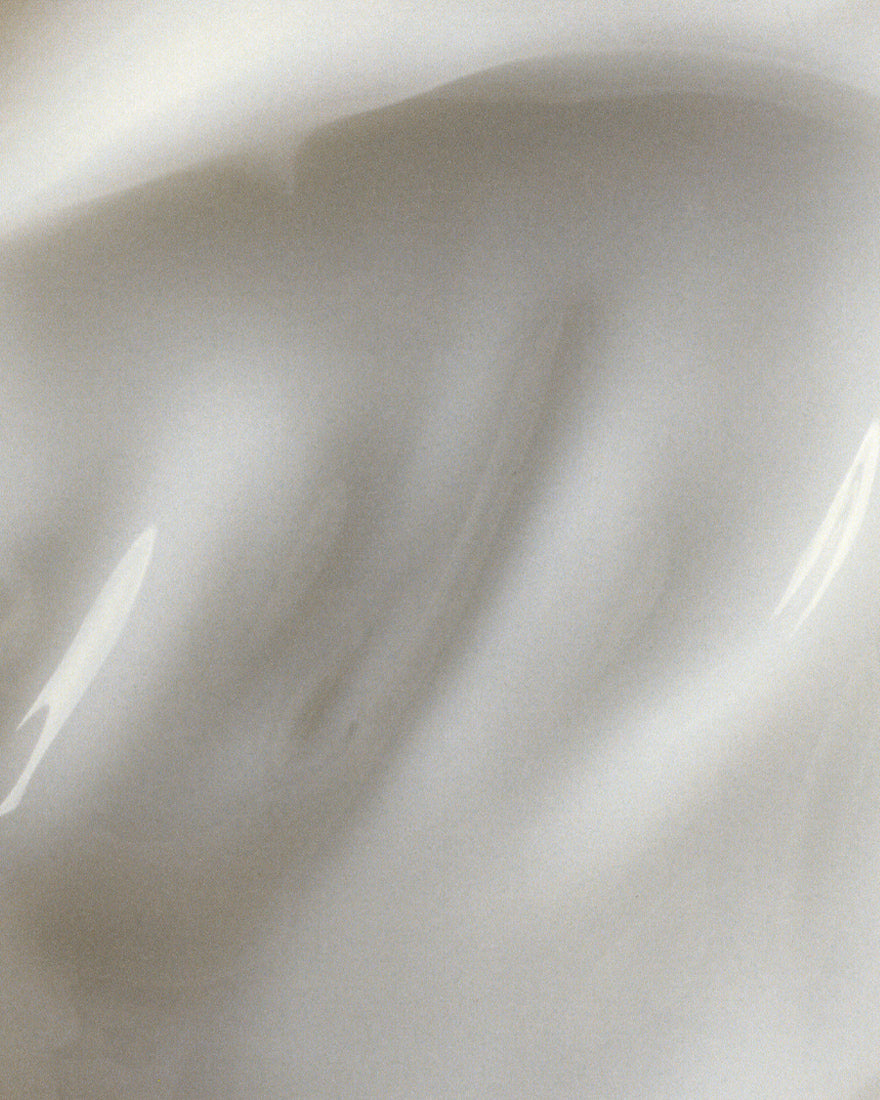 Close up image of the moisturizer formula. It is white in color and looks like a mix of gel and cream. 
