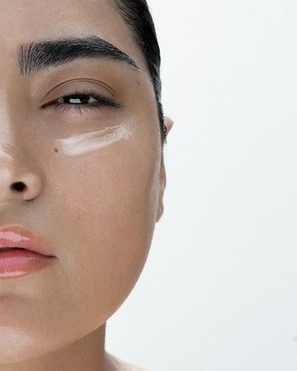 Overnight mask formula on a models face. You can see it under her eyes. The mask is perfect for brining hydration to the under eye area